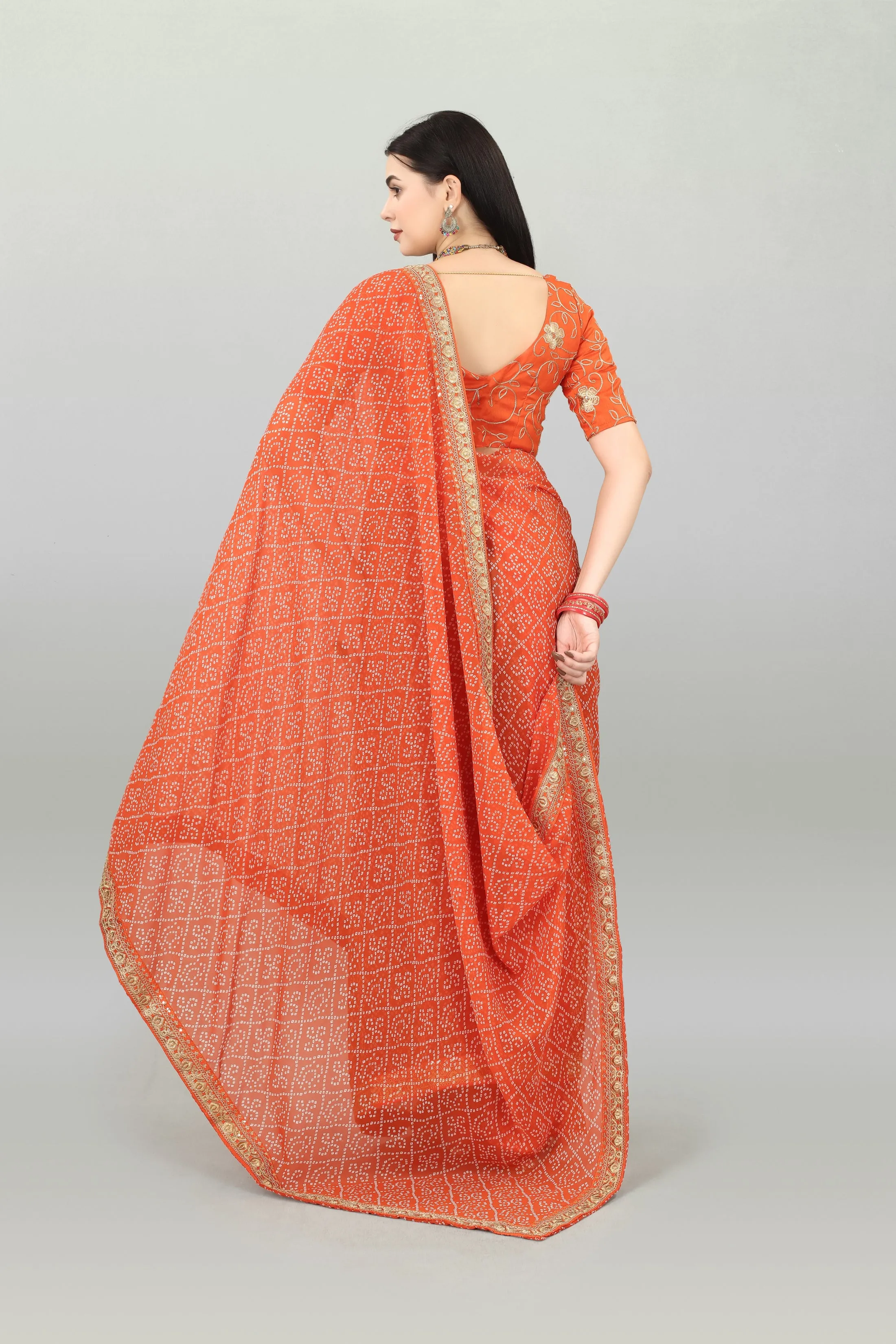 Women Party Wear Bandhani Printed Orange Colour Georgette Saree Collection