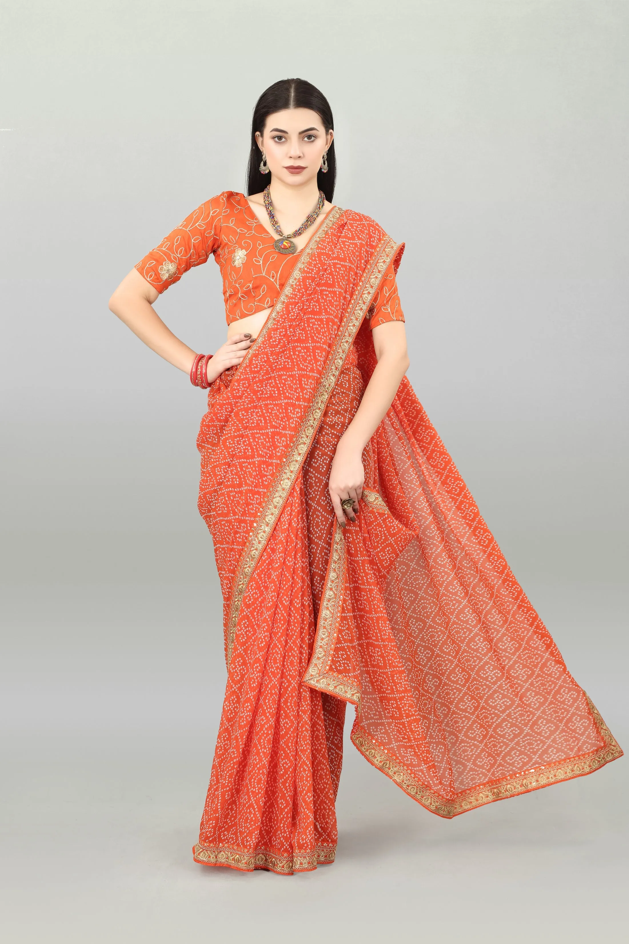 Women Party Wear Bandhani Printed Orange Colour Georgette Saree Collection